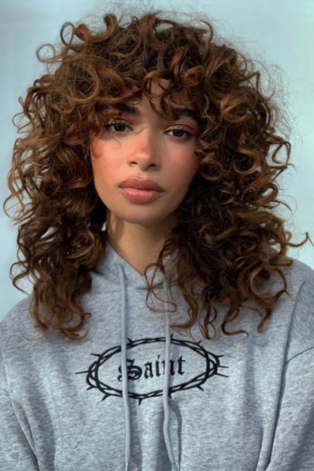 Mid-Length Curly Hairstyle with Curly Bangs